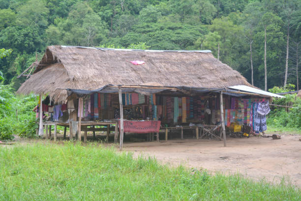 Long Neck Village in Thailand CHIANG MAI, THAILAND - July 10, 2017: Long Neck village in a tribe near Chiang Mai in Northern Thailand. kayan neck rings stock pictures, royalty-free photos & images