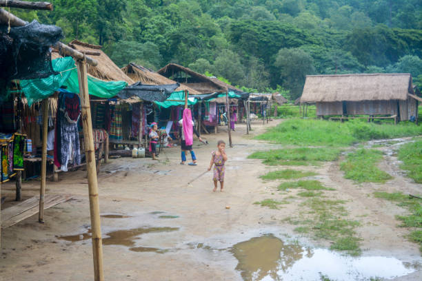 Long Neck Village in Thailand CHIANG MAI, THAILAND - July 10, 2017: Long Neck village in a tribe near Chiang Mai in Northern Thailand. kayan neck rings stock pictures, royalty-free photos & images