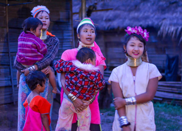 Long Neck Village in Thailand CHIANG MAI, THAILAND - July 10, 2017: Long Neck woman in a tribe near Chiang Mai in Northern Thailand. kayan neck rings stock pictures, royalty-free photos & images