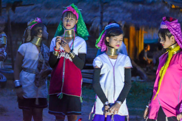 Long Neck Village in Thailand CHIANG MAI, THAILAND - July 10, 2017: Long Neck woman in a tribe near Chiang Mai in Northern Thailand. kayan neck rings stock pictures, royalty-free photos & images