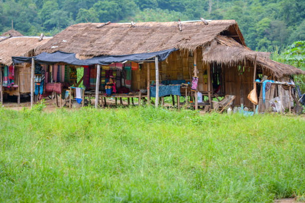 Long Neck Village in Thailand CHIANG MAI, THAILAND - July 10, 2017: Long Neck village in a tribe near Chiang Mai in Northern Thailand. kayan neck rings stock pictures, royalty-free photos & images