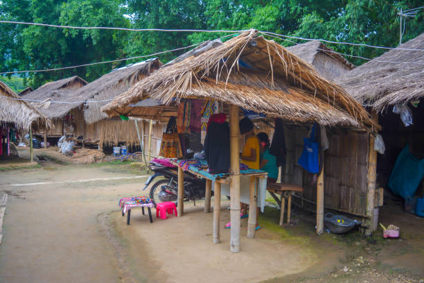 Long Neck Village in Thailand CHIANG MAI, THAILAND - July 10, 2017: Long Neck village in a tribe near Chiang Mai in Northern Thailand. kayan neck rings stock pictures, royalty-free photos & images