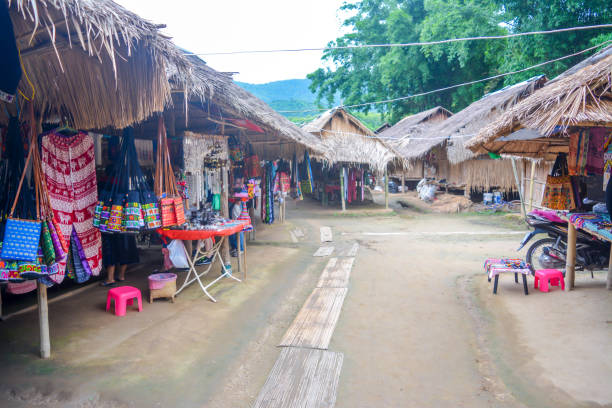 Long Neck Village in Thailand CHIANG MAI, THAILAND - July 10, 2017: Long Neck village in a tribe near Chiang Mai in Northern Thailand. kayan neck rings stock pictures, royalty-free photos & images