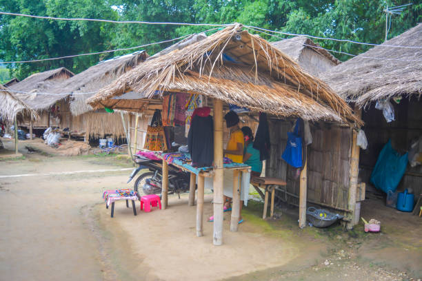 Long Neck Village in Thailand CHIANG MAI, THAILAND - July 10, 2017: Long Neck village in a tribe near Chiang Mai in Northern Thailand. kayan neck rings stock pictures, royalty-free photos & images