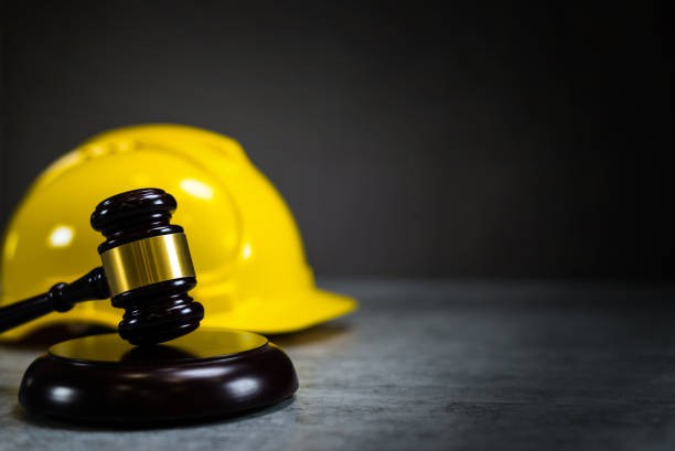 istock Law concept. Yellow Helmet and Judges hammer 814319866