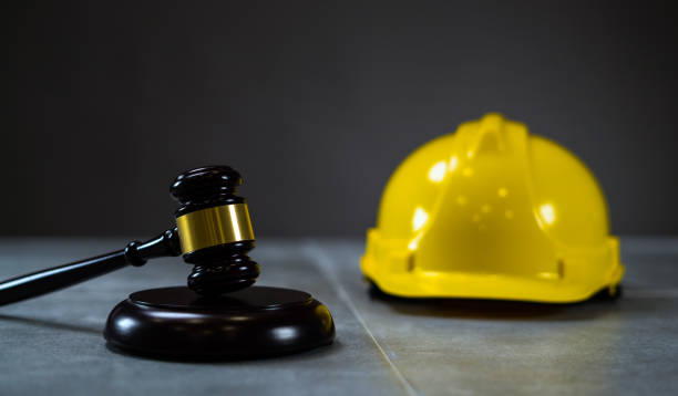 istock Law concept. Yellow Helmet and Judges hammer 814319888