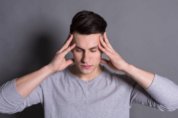 istock Pensive young man portrait at studio background. 814325710