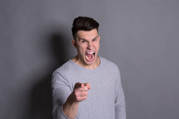 istock Feeling angry, furious man shouting loud 814326038