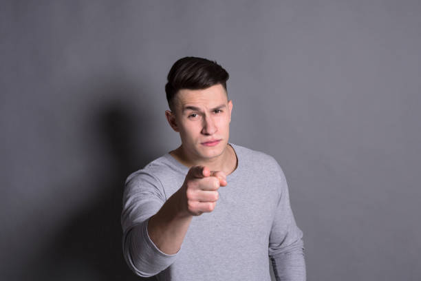istock Strict man gesturing with index finger on you 814326150