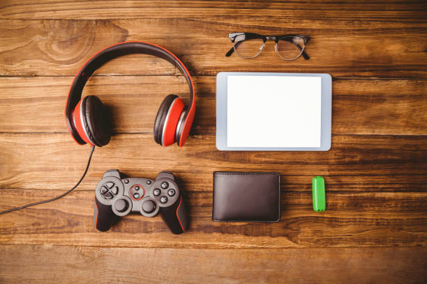 istock Tablet music headphone wallet glasses and USB key 814329304