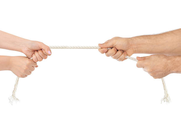 istock Man and woman hands with breaking rope 814331690