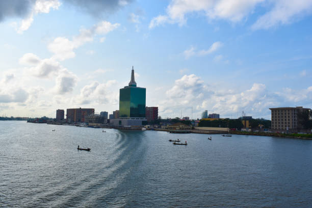 lagos nigeria skyline - africa blue cloud color image stock-fotos und bilder