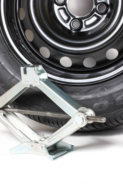 istock Scissor Jack Or Car Lifter And Tire Isolated On White 814332368