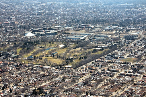 Suburban Chicago - Norwood Park residential neighborhood and golf course shift focus style. United States aerial view.