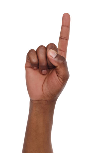 Black hand shows number one isolated Black hand shows number one isolated. Counting gesturing, enumeration, white background human finger human hand pointing isolated stock pictures, royalty-free photos & images