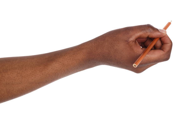 dark-skinned hand holding black pencil - black pencil fotos imagens e fotografias de stock