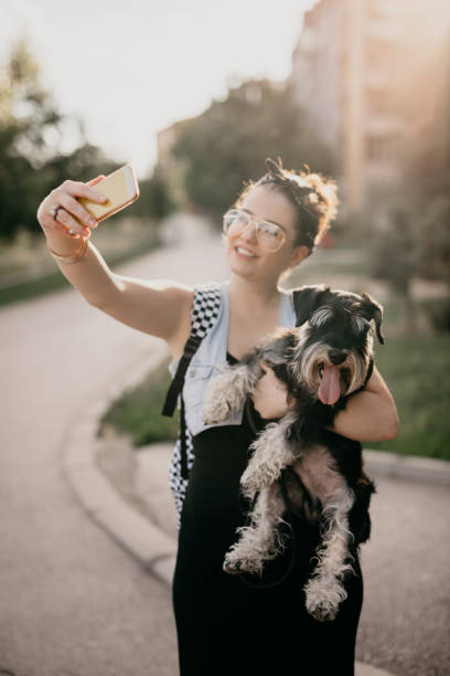 istock C'mon doggy, look at the camera when we are doing selfie 814336550
