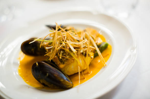 istock baked white fish with mussels 814339174