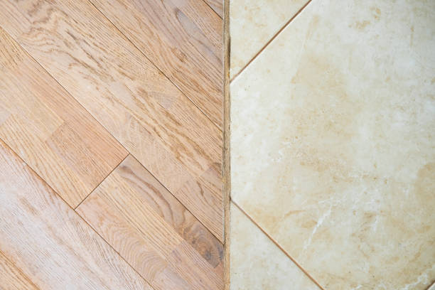 istock Wooden laminate floor and marble tile 814343274