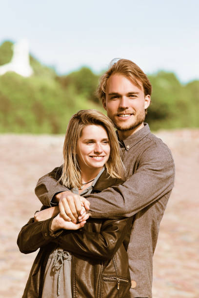 istock Young caucasian couple embracing 814347384