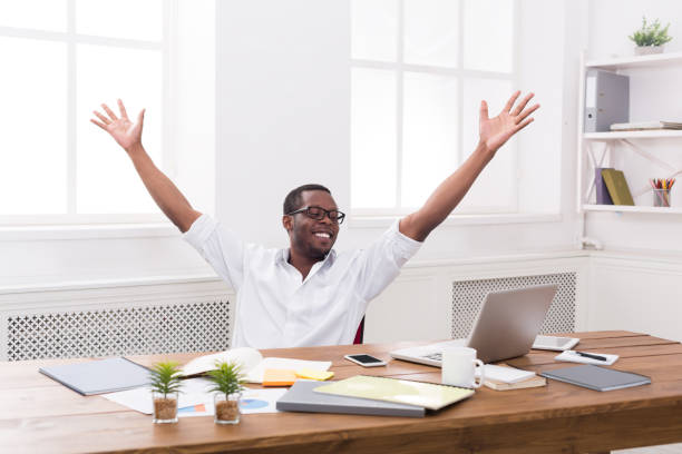 Happy businessman win. Winner, black man in office