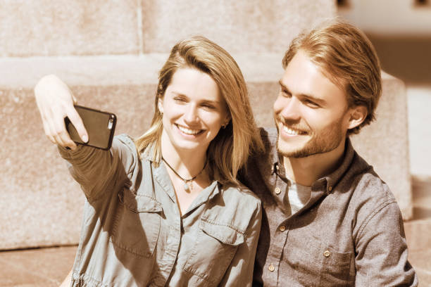 istock Young girl making selfie with her boyfriend 814347546