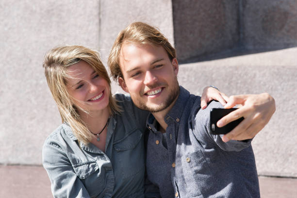 istock Young man making selfie with his girlfriend 814349498