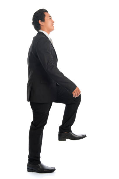 istock Asian businessman stepping up stair case 814349670