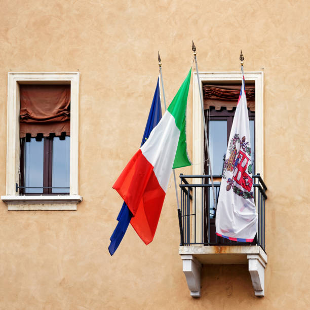 Mantua, Italy - October 22, 2016: Flags on the balcony of a building in Mantua, Lombardy, Italy