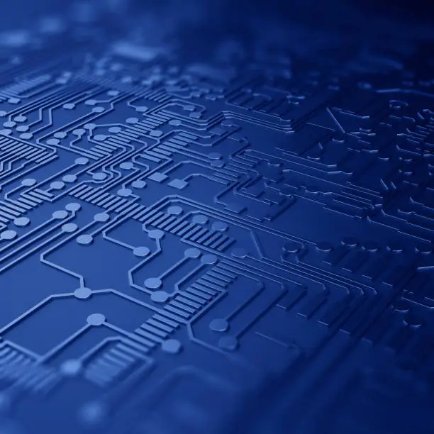 Photo of Close up of a printed blue computer circuit board with depth of field.