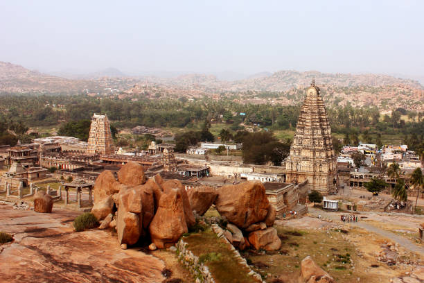 Ancient Virupaksha temple with ruins in Hampi, India Virupaksha temple, a UNESCO heritage site in Hampi, India virupaksha stock pictures, royalty-free photos & images