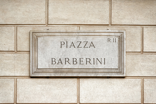 Piazza Barberini street sign on the wall in Rome, Italy