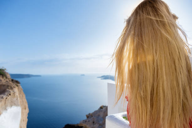 istock Wind & summer & woman & Santorini 814360684