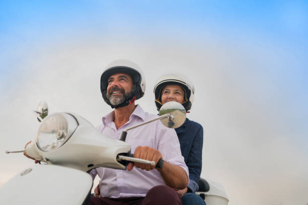 istock Happy Mature Couple Driving Scooter 814363066