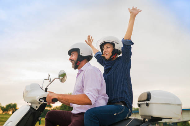 istock Happy Mature Couple Driving Scooter 814365860