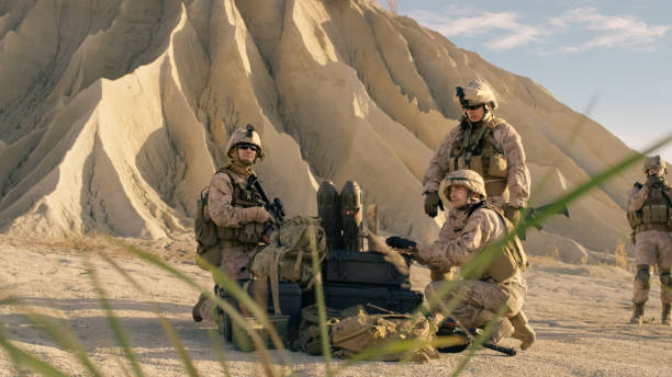 istock Soldiers are Using Laptop Computer for Surveillance During Military Operation in the Desert. 814367208
