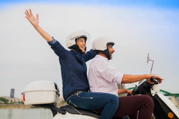 istock Happy Mature Couple Driving Scooter 814367984