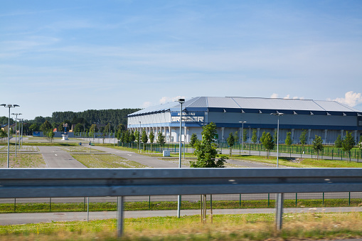 Football Arena of Paderborn seen from passing road outskirts of Town. At corner is name of stadium. Name is Benteler-Arena and offers seats for 15.000 people.