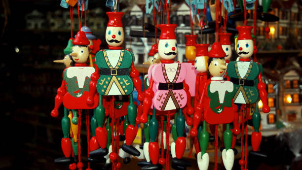 istock Colored puppet hanged in the shop 814386384