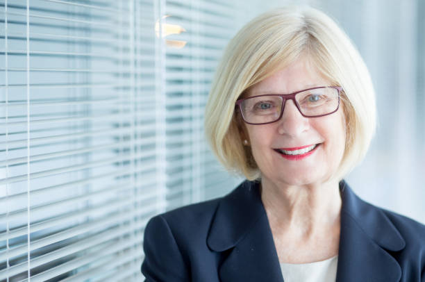 istock Experienced senior female executive in eyeglasses 814390808