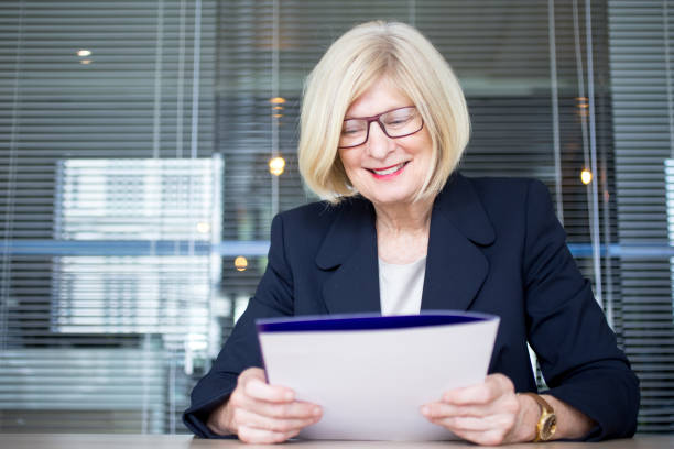 istock Positive senior HR worker holding personal file 814390868