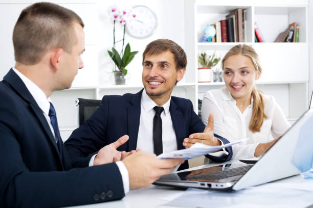 istock Business colleagues with document in hands 814394338