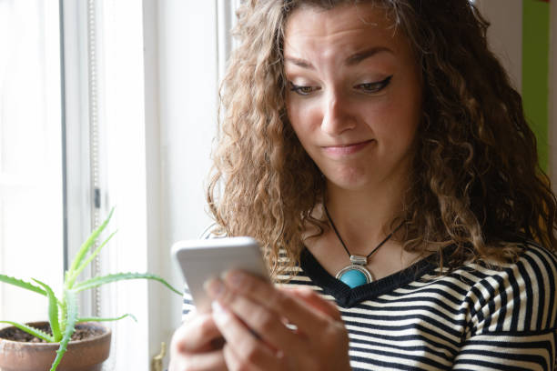istock Young Woman Using Smartphone Indoors 814403266