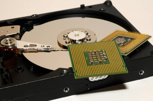 istock close up of opened hard disk with two CPU processors over. technology background. abstract. 814405130