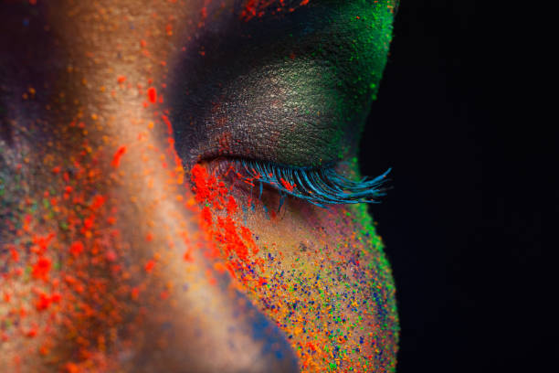 istock Eye of model with colorful art make-up, close-up 814423672