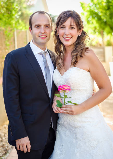 istock couple just married rose hand 814442516