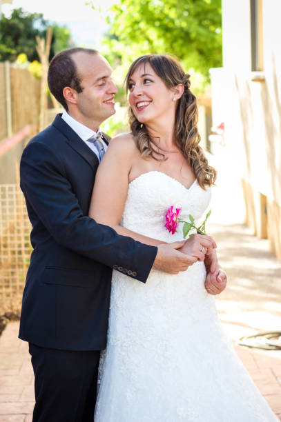 istock couple just married back bride face to face 814442590