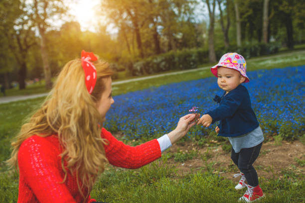 istock Little girl in spring park 814443012