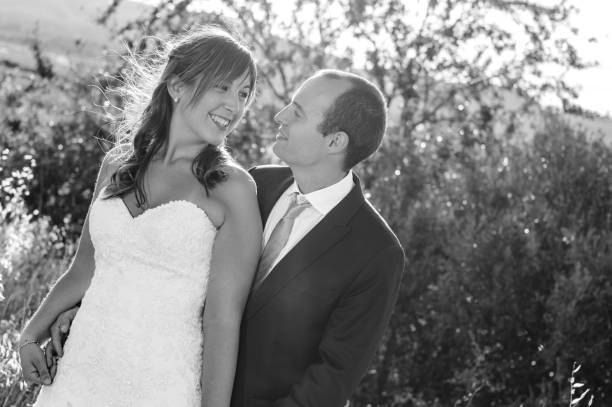 istock couple married happy looking each other 814443044