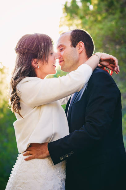 istock couple just married looking each other forest 814443620